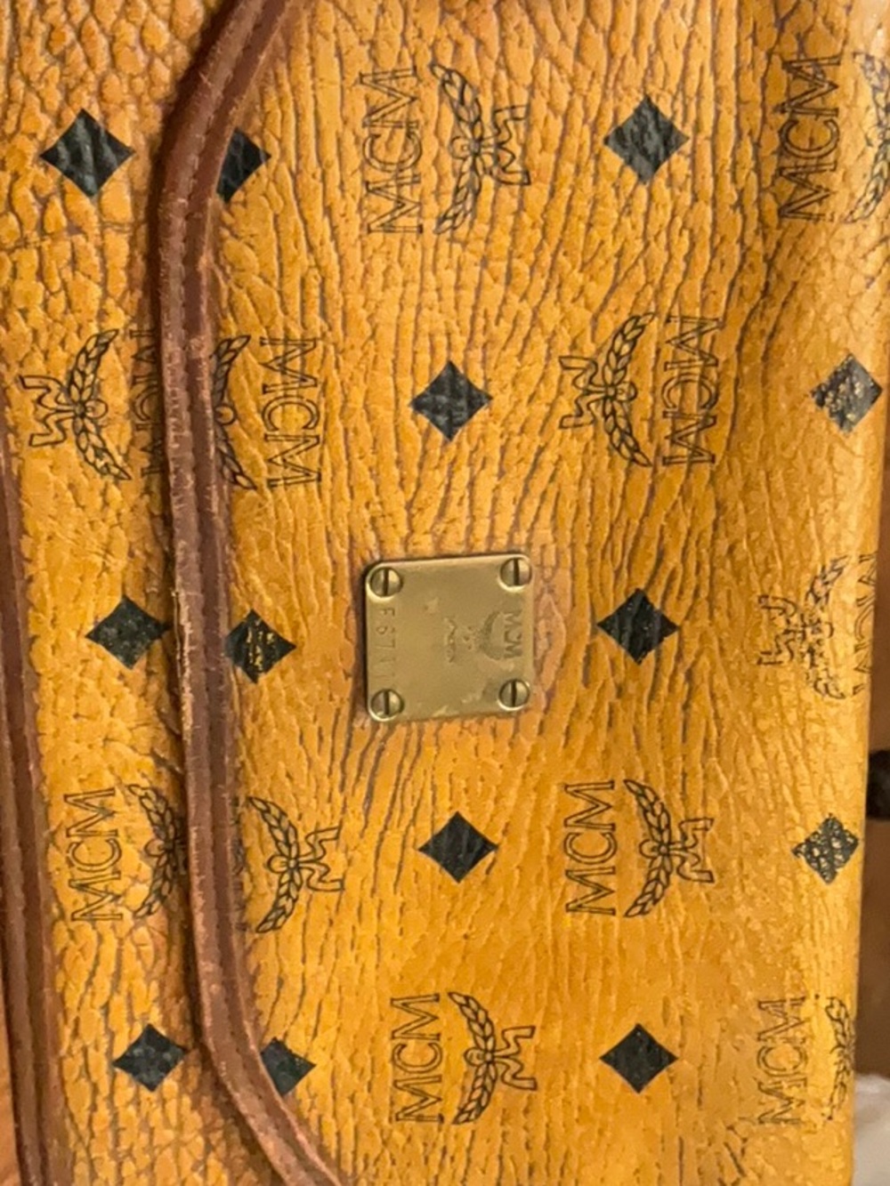 used Lux MCM clutch ware  on corners darken inside flap beautiful clutch $1000R